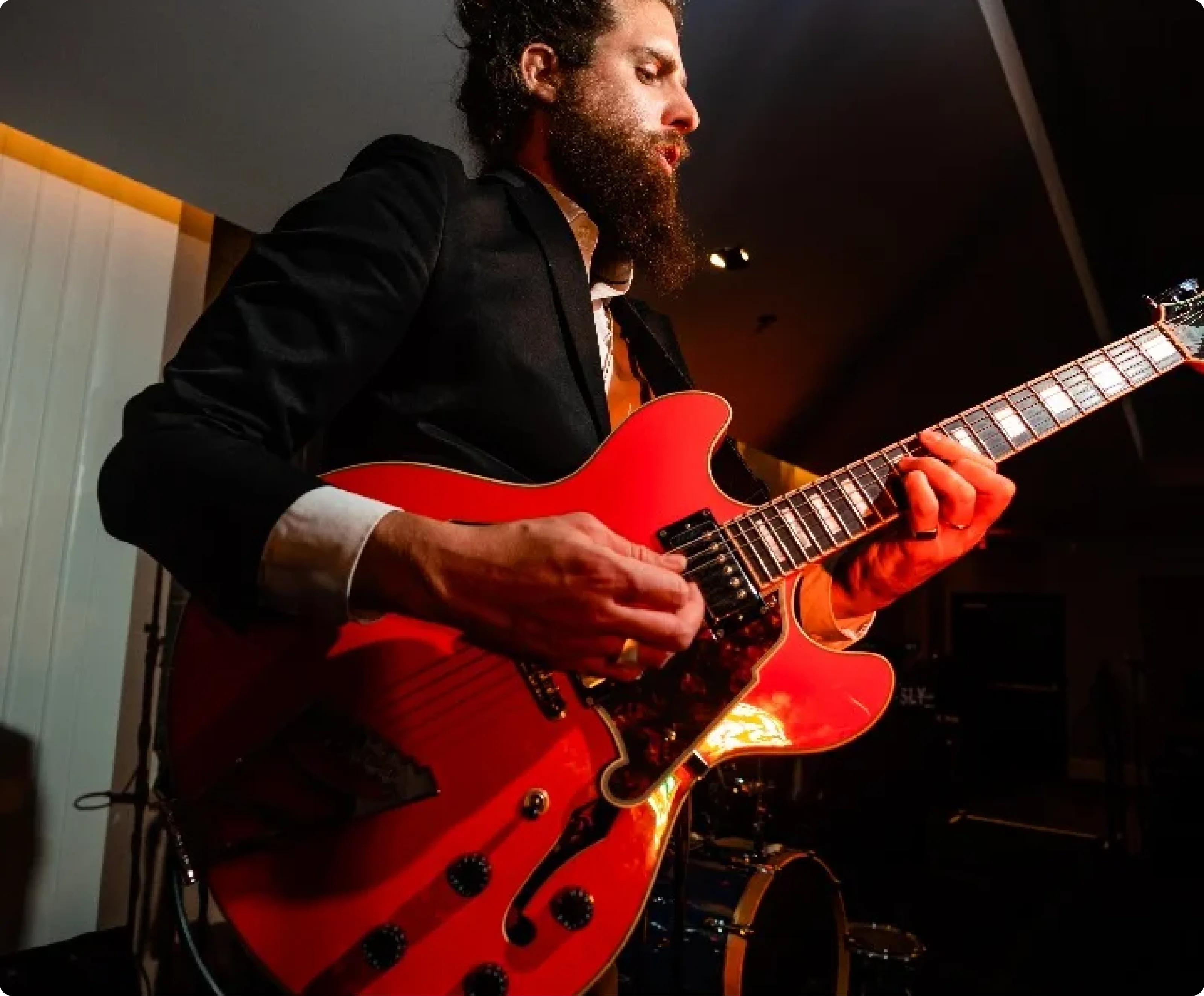 A guitarist performing live at a bar mitzvah celebration