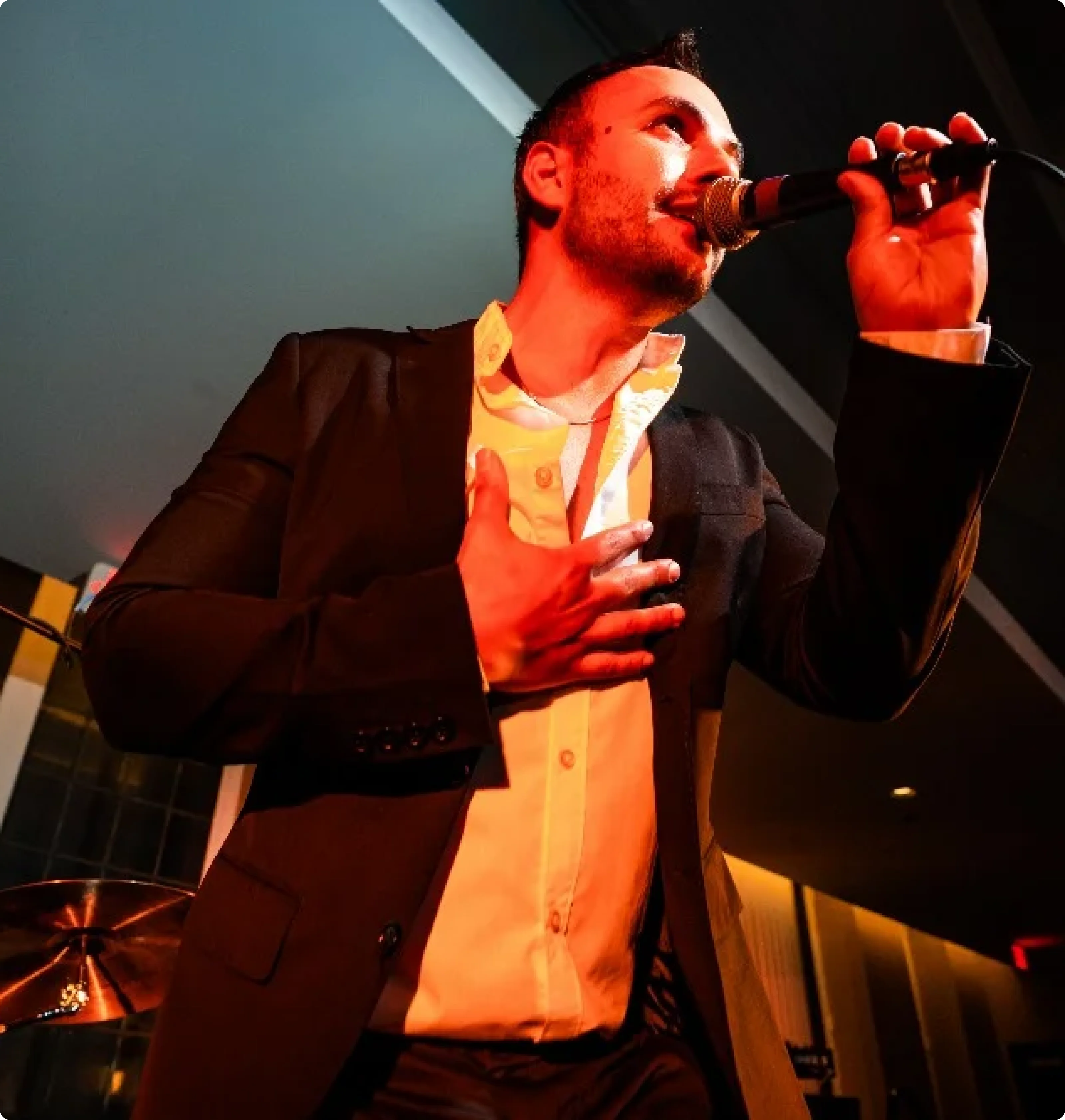 A vocalist singing live at a bar mitzvah celebration